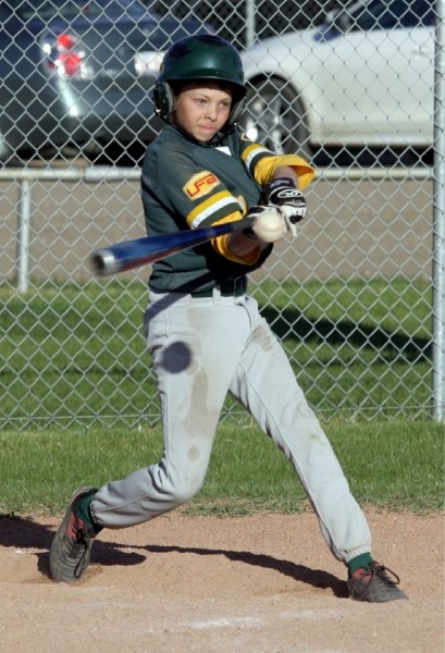 Shelby Tkachyk hits a single during the Westlock Pee Wee Wild&#8217;s game against the Grande Prairie Reds May 14. The Wild dropped the game 17-4.