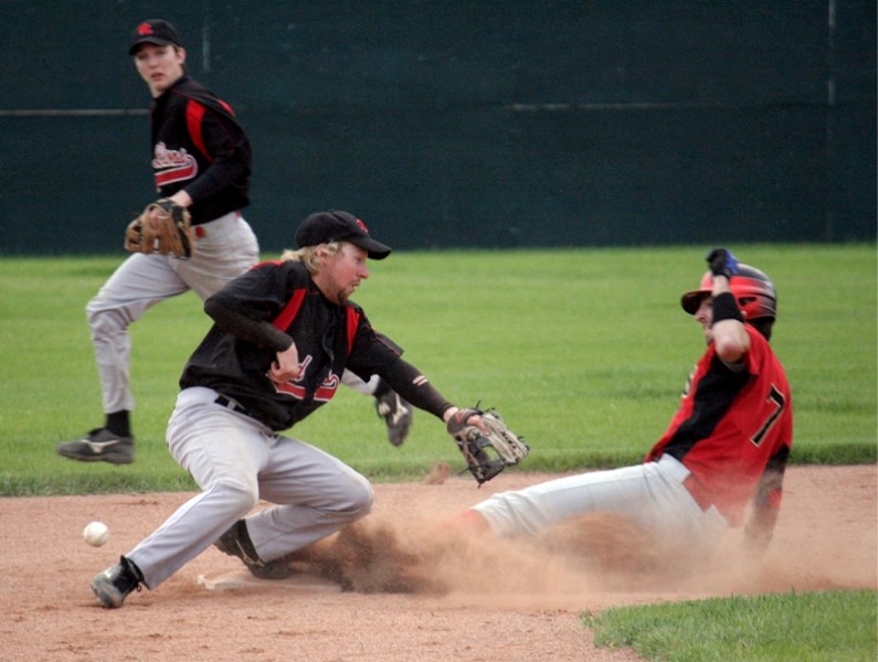 Red Lions shortstop Jordan Brand tries to apply a tag on an Edmonton Athletic stealing second base, with second baseman Matt Hutchings backing him up. Despite the missed out, 