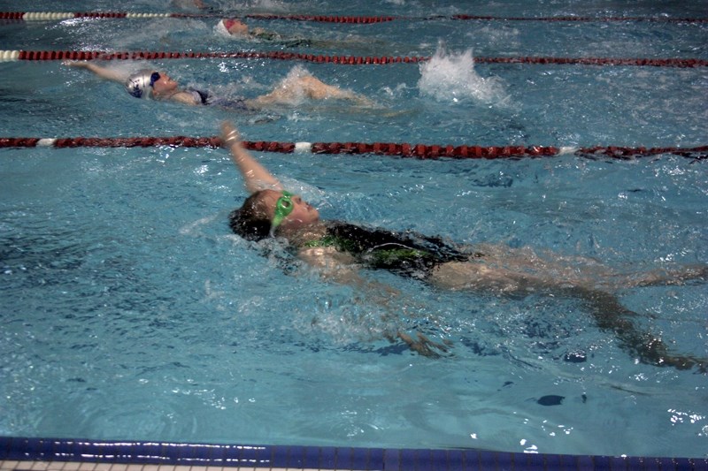 Westlock Gator Camille Williams competed in the 25-metre backstroke event at the Westlock Gators&#8217; swim meet last weekend. The event brought hundreds of young athletes
