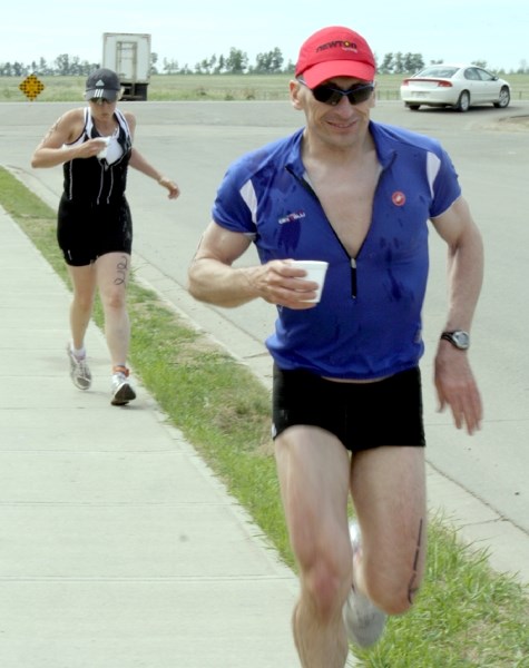 Racers in the Westlock Triathlon make their way through town during the June 11 event.