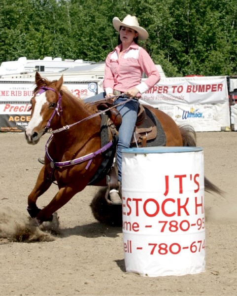 Westlock&#8217;s Corbyn Pankonin rounds a barrel during the ladies barrel racing at the Long Island Lake Rodeo June 11.