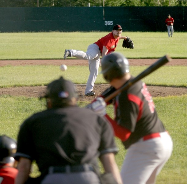 Red Lions pitcher A.J. Bosman delivers a strike against the Edmonton Warriors June 22 at Keller Field. Bosman surrendered only one hit in pitching a complete game shutout and 