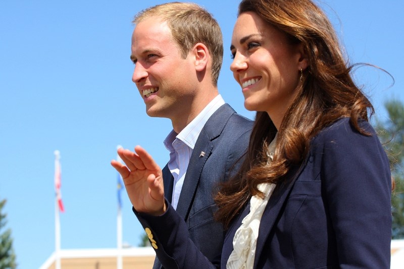 Will and Kate make their way towards the crowd after meeting with emergency workers and displaced residents.