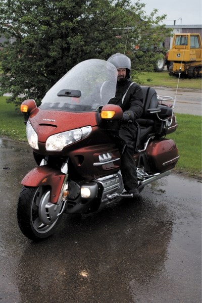 Murray Reeder gets set to head off into the rain on the Ride for STARS July 9. He was joined by 16 other riders raising money for the air ambulance service.