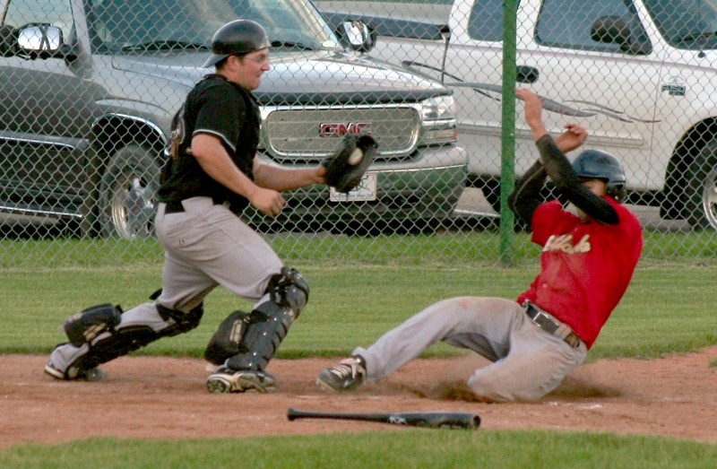 Ryan Rau slides into home plate to score the Lions&#8217; fourth run against the Parkland White Sox during Tuesday&#8217;s game. The Lions beat the first-place Sox 6-2.