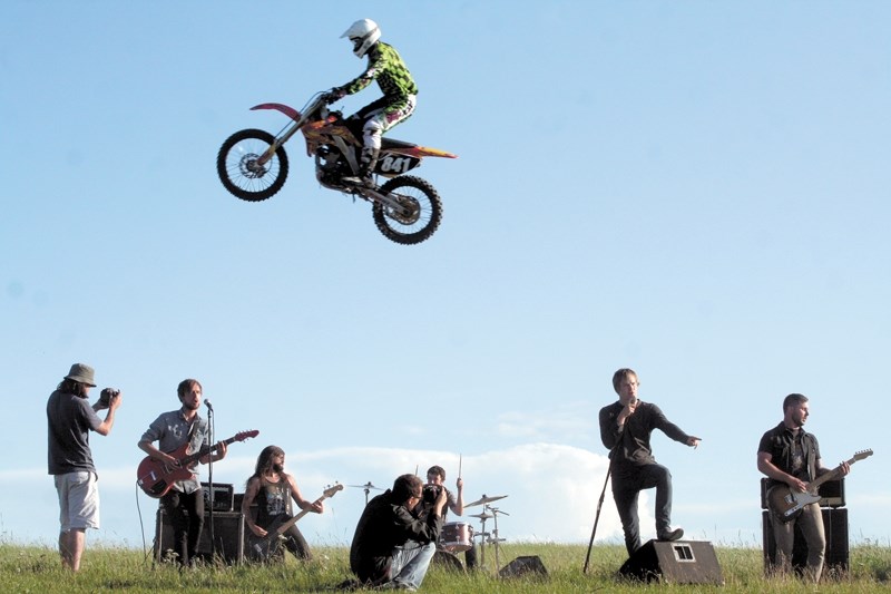 Frank Barry (above) leaps over the band Ten Second Epic and the cameramen filming them. The band was out at Barry&#8217;s Ultra Motorsports Park last Wednesday to record