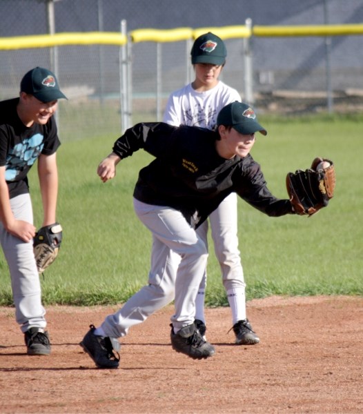 Zack Frith-Smith makes a play at third base during a fielding drill at the pee wee Wild&#8217;s practice July 20.