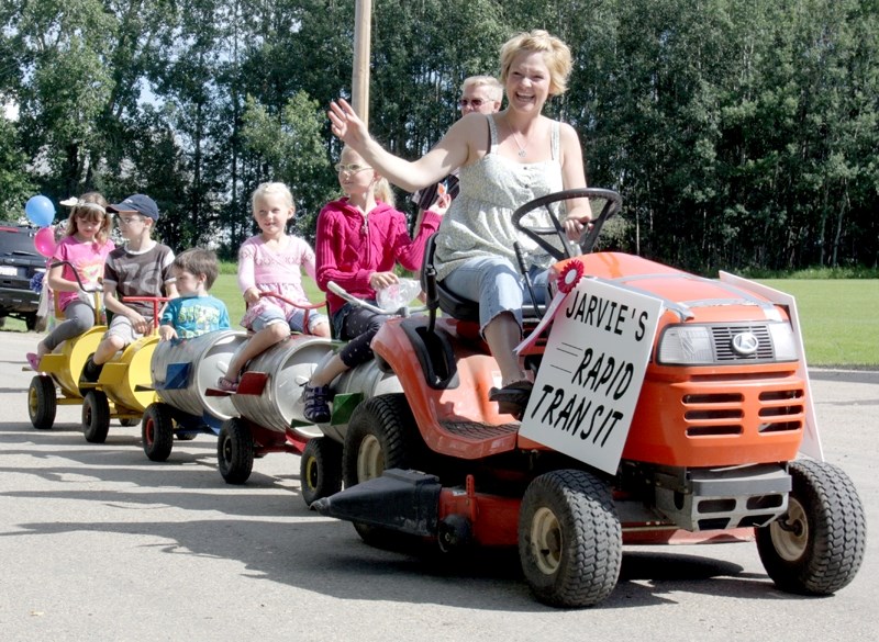 Jarvie was rife with family-friendly fun last Saturday during Jarvie Days. Michelle Cuthbertson heads up Jarvie&#8217;s Rapid Transit Service during the parade.