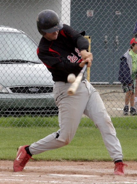 Trevor Miller pops up in the bottom of the first inning of the Red Lions&#8217; game against the Sherwood Park Athletics Aug. 7 at Keller Field.