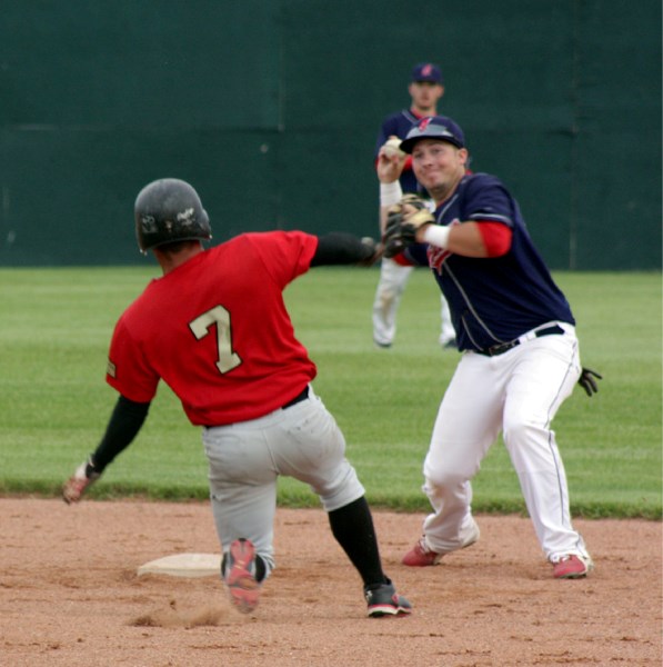 Westlock&#8217;s James Baird sprints for second, two seconds too late, as Legal&#8217;s Kyle Fagnan is already preparing to throw to first to make a double play. Regardless,