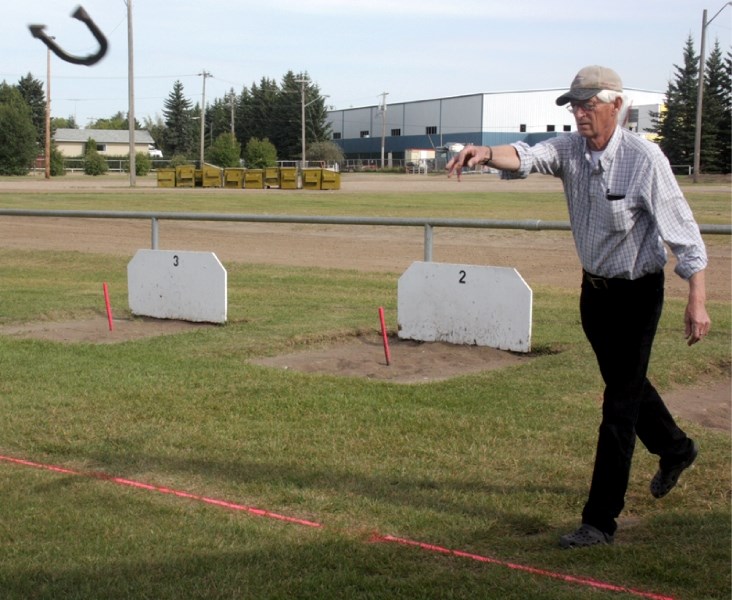 Alvin Nanninga, Canada&#8217;s 2011 national horseshoe champ in the seniors&#8217; 30-foot category, demonstrates how to throw a ringer at the Westlock horseshoe pits in