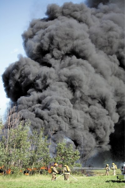 Town and county firefighters spent several hours Aug. 23 fighting a huge tire fire in the east end of town. The fire was accidentally started by two children playing with a