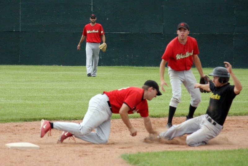 Red Lions shortstop Trevor Miller tags out an Edmonton Blackhawk baserunner in the third inning of game one of the teams&#8217; semifinal series Aug. 20 at Keller Field. The