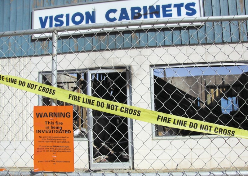 Vision Cabinets was empty and fenced off last week after a fire tore through a west-end strip mall.