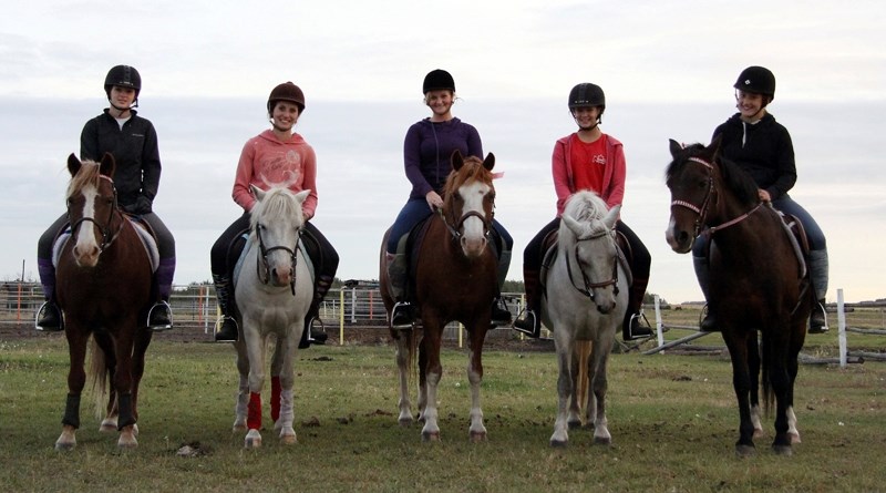 Full Throttle team members L to R: Megan Dick, Kearstyn Sabourin, Amelia McLean, Taylor Brenneis and Dana VanBrabant pose during a team practice Aug. 31. The team finished