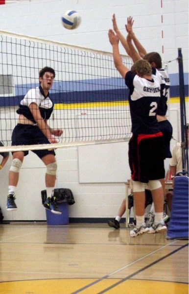 St. Mary Shark Mark Ritter spikes the ball during the club&#8217;s gold-medal game victory over the Barrhead Composite High School junior varsity Gryphons on Saturday.