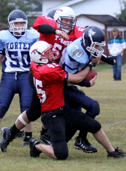 Westlock Thunderbirds&#8217; Mitchell Kosh and Wayne Gross work to tackle Vegreville&#8217;s Cody Gottselig during Thursday&#8217;s 41-0 win. The victory improves the
