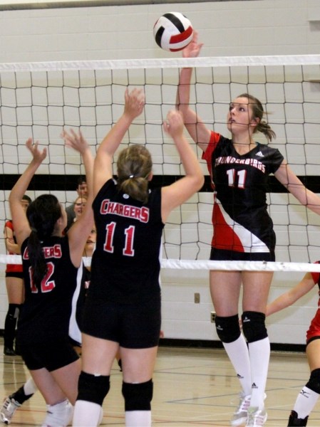T-Birds powerhouse Kristen Jensen slams one over the net to help the team to its gold-medal finish over the weekend.