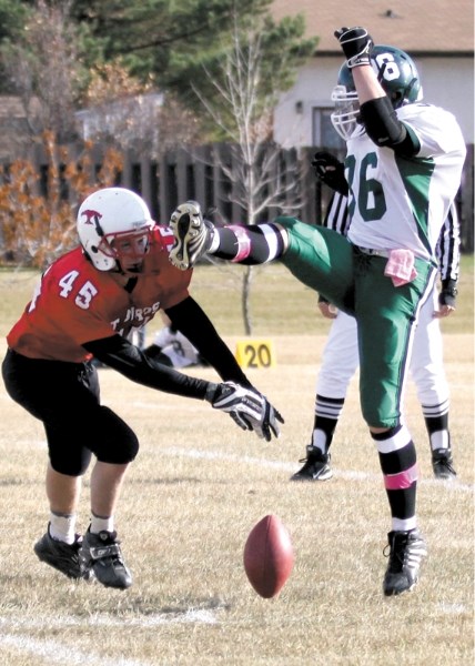 Westlock T-Bird Mitchell Kosh blocks a punt by Athabasca Pacer Brad Russell during Saturday&#8217;s Wheatland Football League playoff matchup at Westlock Elementary School.