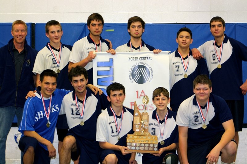 The St. Mary School Sharks celebrate with their zone championship banner at home Saturday night. The club now travels to New Norway School for the 1A provincials.