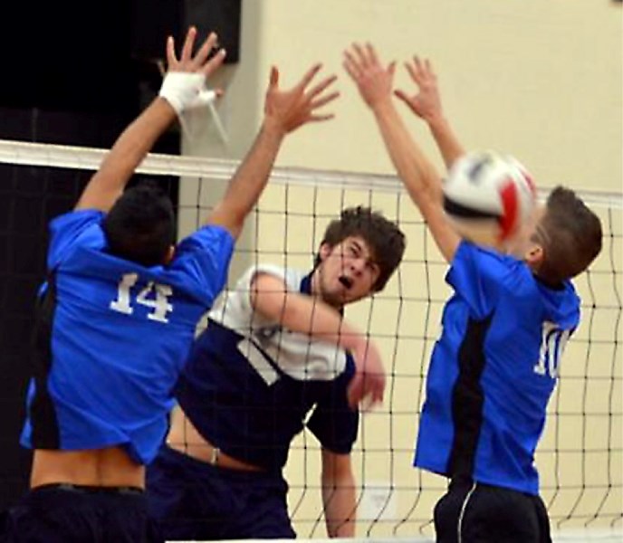 St. Mary Shark Mark Ritter spikes a ball past the defence during one of the round-robin games at the provincial tournament.