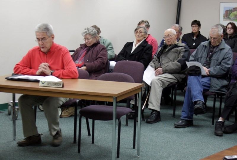 Westlock town council chambers were packed with more than30 residents for a public hearing on a proposed development in Southview last week. Guy Gokiert (left) spoke against