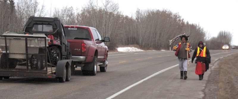 Kevin Soto and Audrey Auger walk south on Highway 44 to honour Auger&#8217;s daughter in the Highway of Hope healing walk.