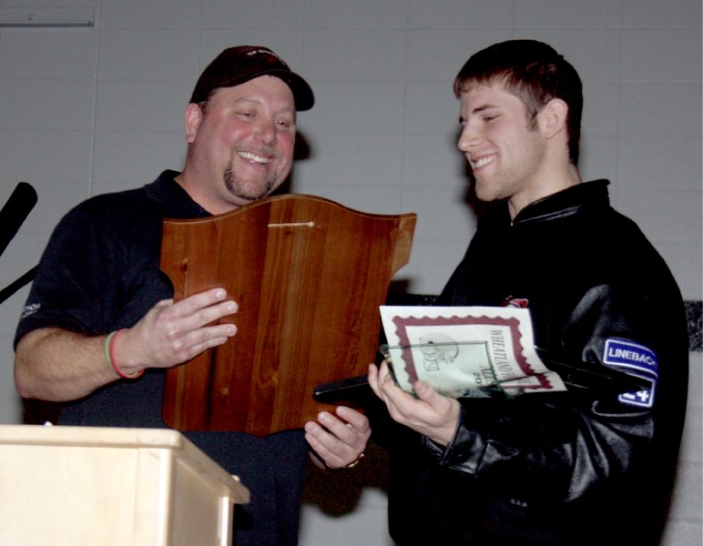 Westlock Thunderbirds&#8217; defensive coach Shayne Frith-Smith (left) presented Royce Hadley with the Wheatland Football League award for Tier 2&#8217;s Most Valuable