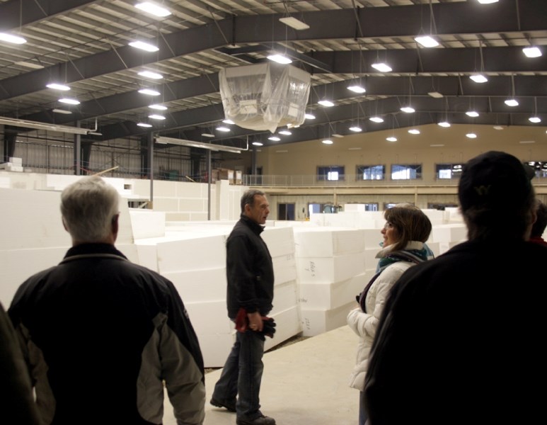 On Saturday Westlock CAO Darrel Garceau (centre) showed off the new score clock and styrofoam risers that will be used in the construction of the seating in the arena.