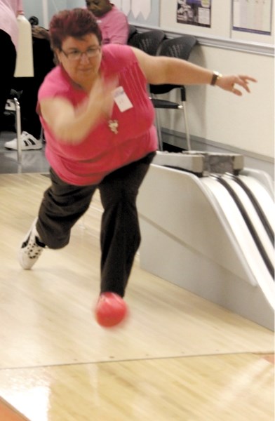 Top fundraiser Roseann Gezmish, who brought in $1,225 for the Knockdown Cancer fundraiser, bowls at the wrap-up event on Sunday, Jan. 29.