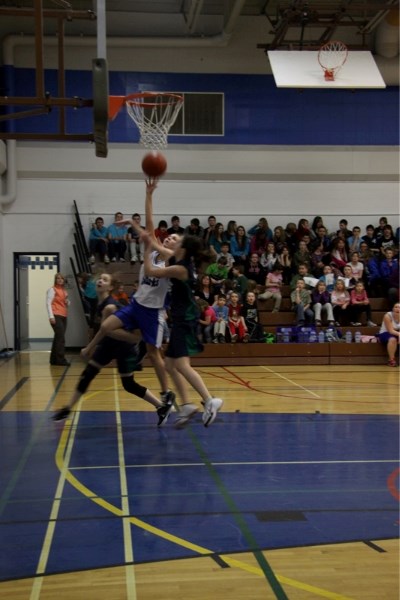 Mariah Properzi goes for a layup during the Sharks&#8217; opening game of the Cathy Mitchell Memorial tournament in Westlock last weekend.