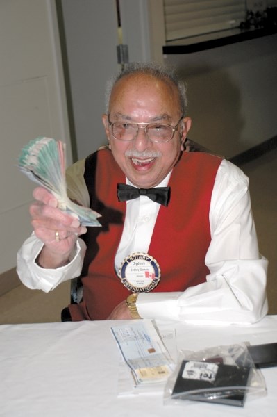 Dr. Sydney Gomes during a light-hearted moment at the Westlock Rotary Dinner Theatre production of Patsy Cline in 2007. Dr. Gomes looked after the finances for a number of