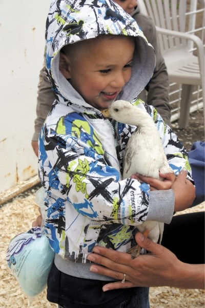 A visitor to Wacky Saturday in 2011 gets to hold a duck at the petting zoo. This year&#8217;s Wacky Saturday will feature plenty of other fun activities for families.