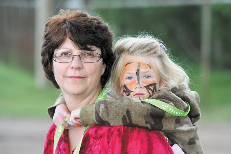 Joyce Thordarson gave a piggyback ride to her grand-daughter Abby while taking part in the Telus Walk to Cure Diabetes.
