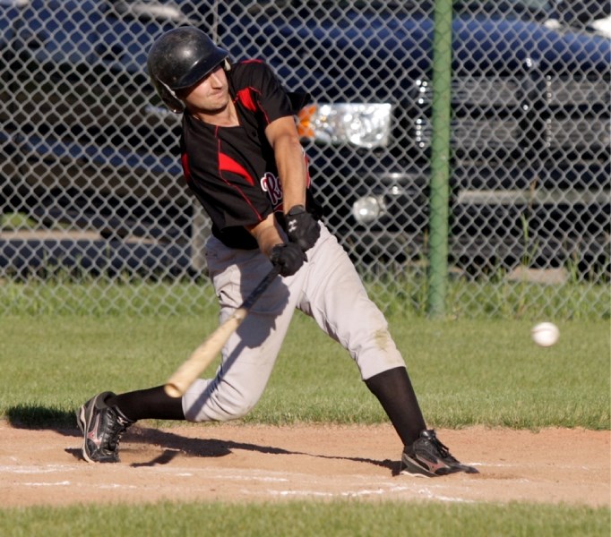 Ryan Teske takes a rip at this pitch in second inning of the Westlock Red Lions&#8217; 2-1 win over the Sherwood Park Athletics last week. Teske connected with the pitch and
