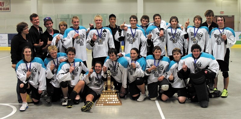 The midget Rock celebrate after beating the Sherwood Park Titans on July 4. Back row L-R: Sheila Kulmatyski (manager), Martin Clausen (coach), Brett Walker (coach), Tristen