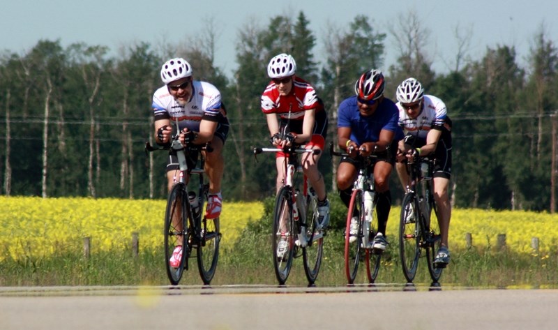 Westlock native Derek Lux, followed closely by his friend Terra Giggey and two other riders, left the lunch stop in Westlock during the Tour de l&#8217;Alberta last Sunday.