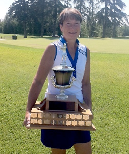 Ladies&#8217; Open champion Debbie Shoemaker with the winner&#8217;s trophy. This year was the third time she won the tournament.