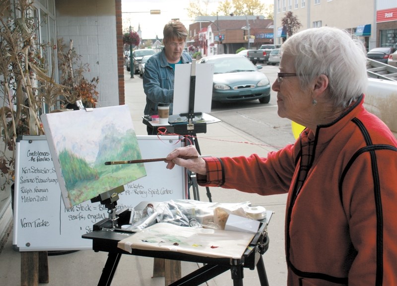 Local artists Roberta Peirson (right) from Westlock and Marilynn Jeffery from Barrhead took to Main Street in Westlock last Monday where they did an impromptu &#8220;Pop up