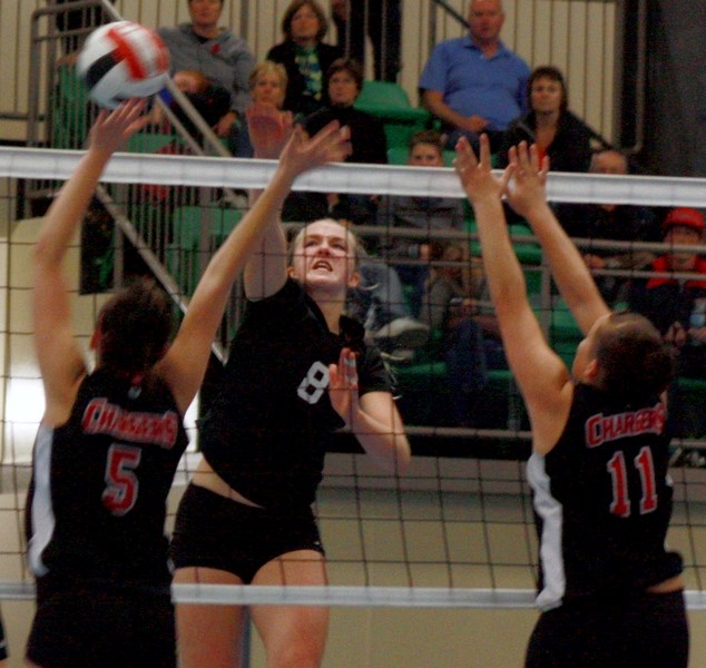 Briana Carlyon spikes the ball during the Thunderbirds’ final match against the Hilltop Chargers during final match against the Hilltop Chargers on Saturday.