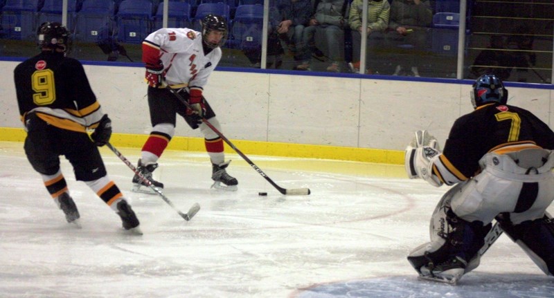 Warrior Steven Mayowski lines up a shot against the Warburg Mustangs’ goalie during a 5-4 Friday night win at the Westlock Rotary Spirit Centre.