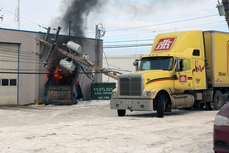 The scene after a rig knocked over a power pole, sparking a dumpster fire on Nov. 14.
