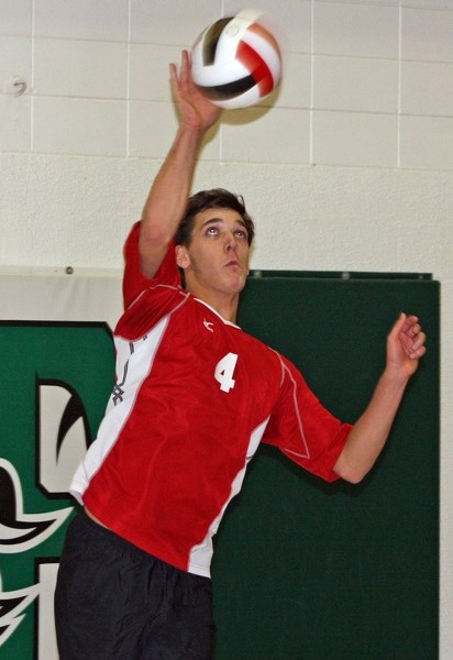 Aaron Graf delivers a serve at the zone tournament at Edwin Parr Composite in Athabasca over the weekend.
