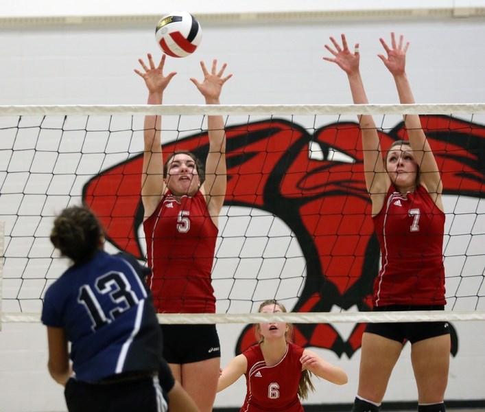 R.F. Staples T-Birds Sydney Toma (5) and Kristin Jensen (7) go up for a block against Edson on Friday night. The girls lost the match, but rebounded to make the final, where