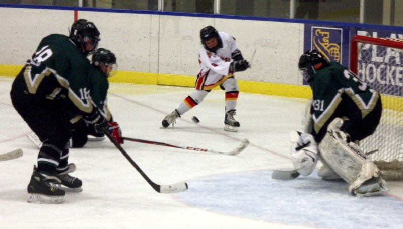 Westlock’s Thomas Schwartz takes a shot on net during the Tier 2 Pee Wee Warriors’ 7-3 exhibition-game loss to the Spruce Grove Chiefs last Saturday afternoon. Despite a