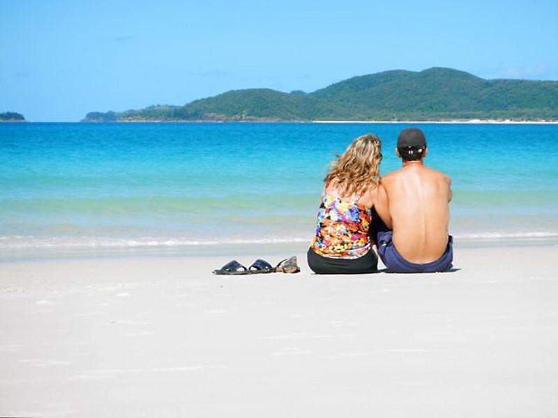 Rick and Colleen Sereda enjoyed a chance to relax while on Rick’s teacher exchange in Cairns, Australia. The Seredas gaze out at the view while sitting on Whitehaven Beach on 