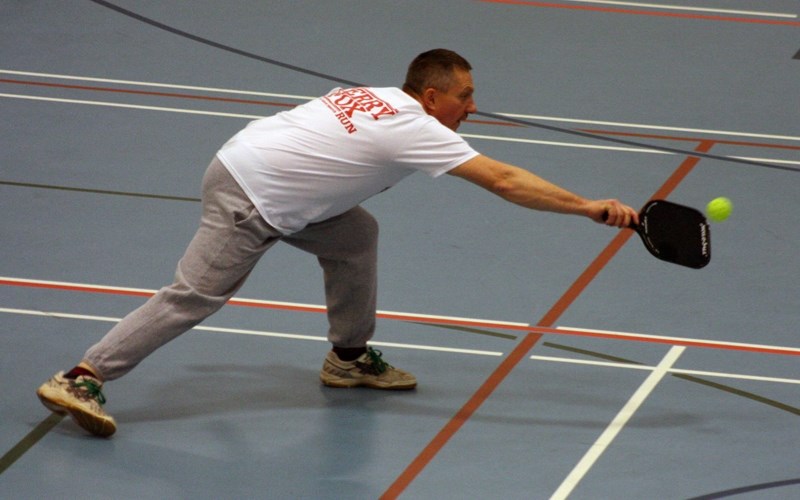 Tony Gerun gets a piece of the pickleball during the Monday-night drop-in league at the Westlock Rotary Spirit Centre. The sport combines elements of tennis, badminton and