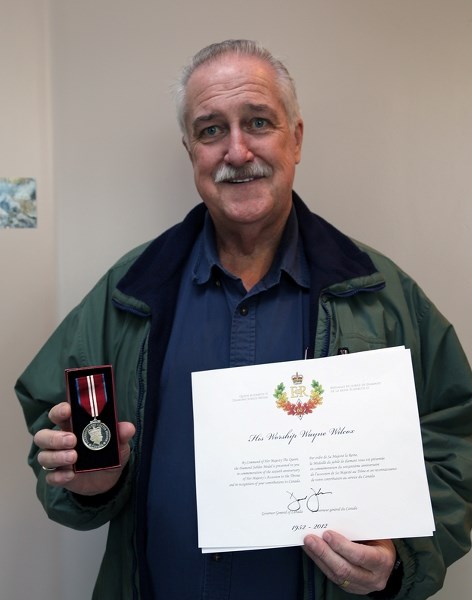 Clyde mayor Wayne Wilcox happily shows off his Diamond Jubilee Medal, which he received to recognize his hard work in the Clyde community.