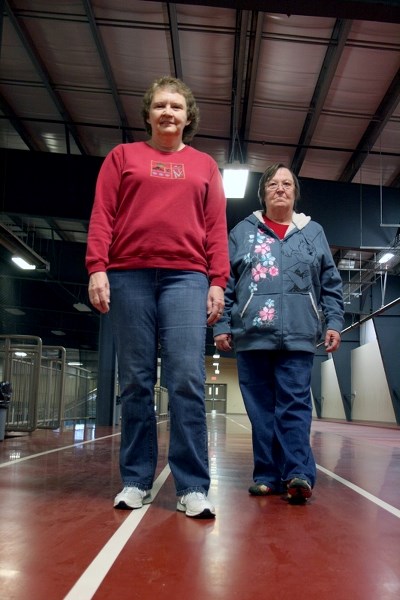 L-R: Lorraine Rebman and her friend Melba Nelson push each other to stay active by walking laps at the Spirit Centre every week. The duo began the routine to prevent chronic