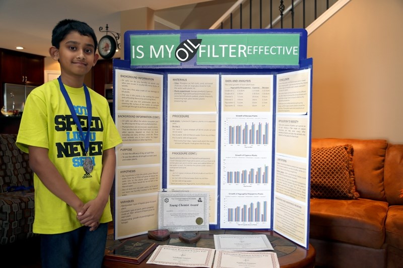 Siddhant Gautam shows off his project back board and the awards he won in this year’s science fairs.